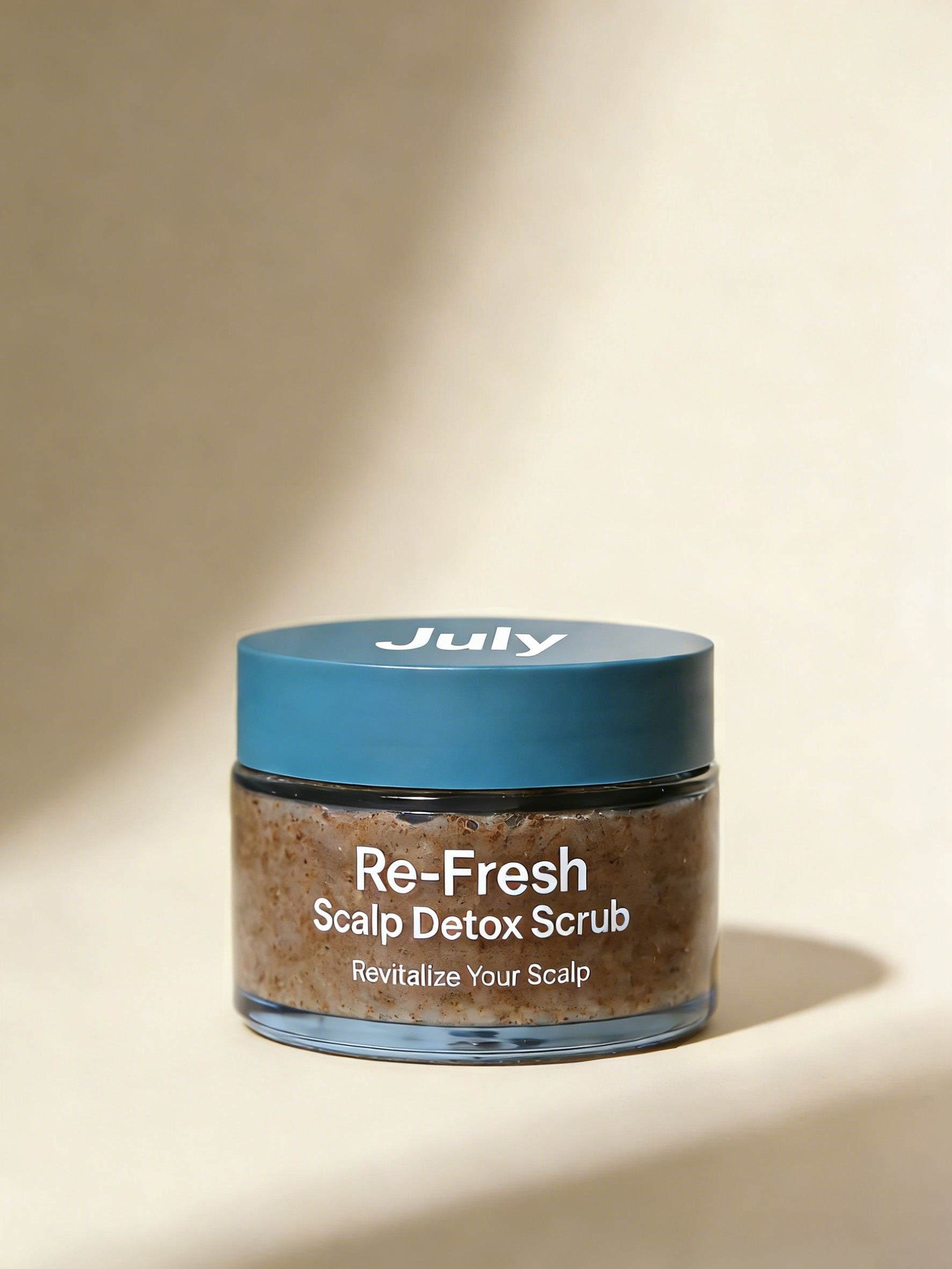 Jar of Re-Fresh Scalp Detox Scrub with blue lid on a beige background